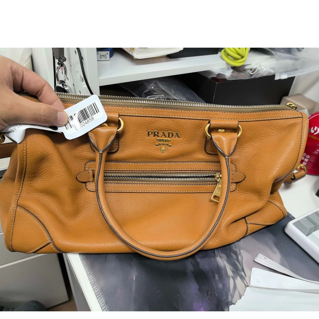 95新 Prada/普拉达 斜挎包姜黄色DS024858