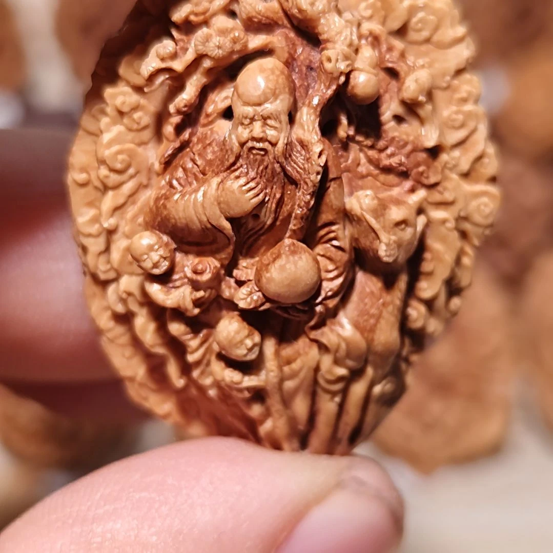 桃核纯手工雕刻寿星