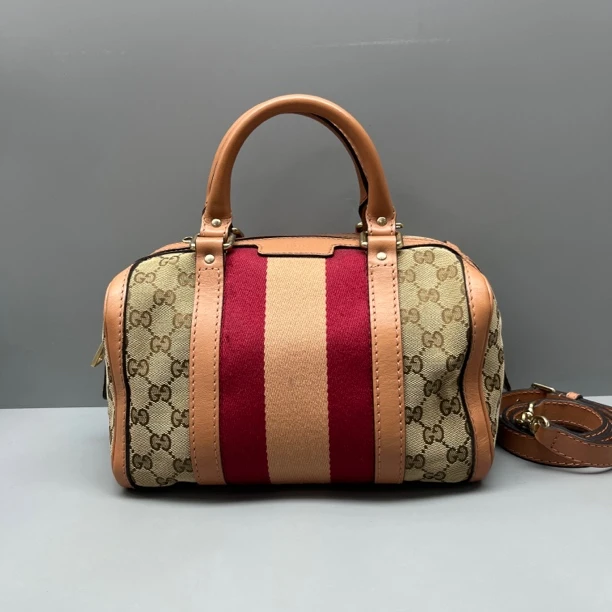 95新 GUCCI/古驰 老花帆布拼皮枕头包 尺寸25*16 SV16858