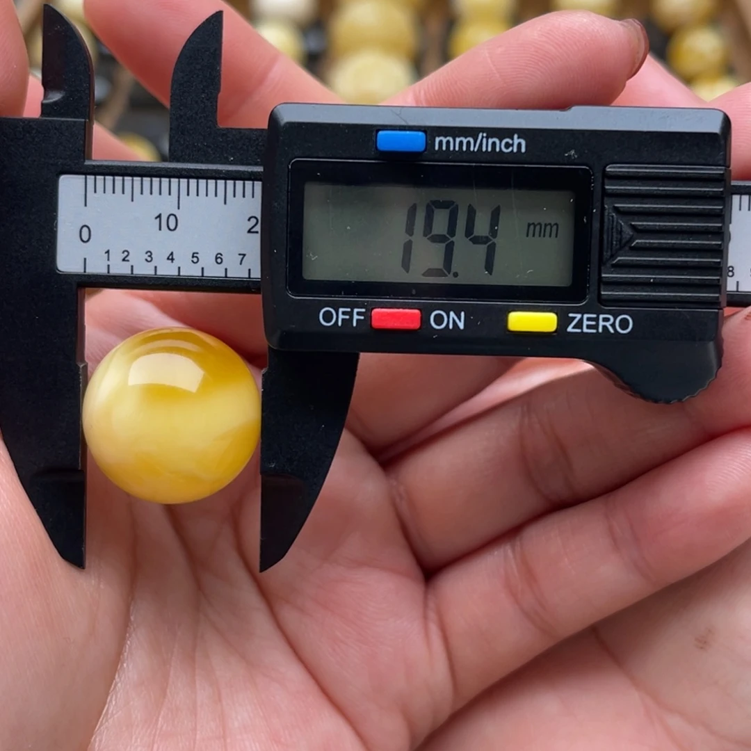 Y***y琥珀未镶嵌裸石蜜蜡圆珠笑