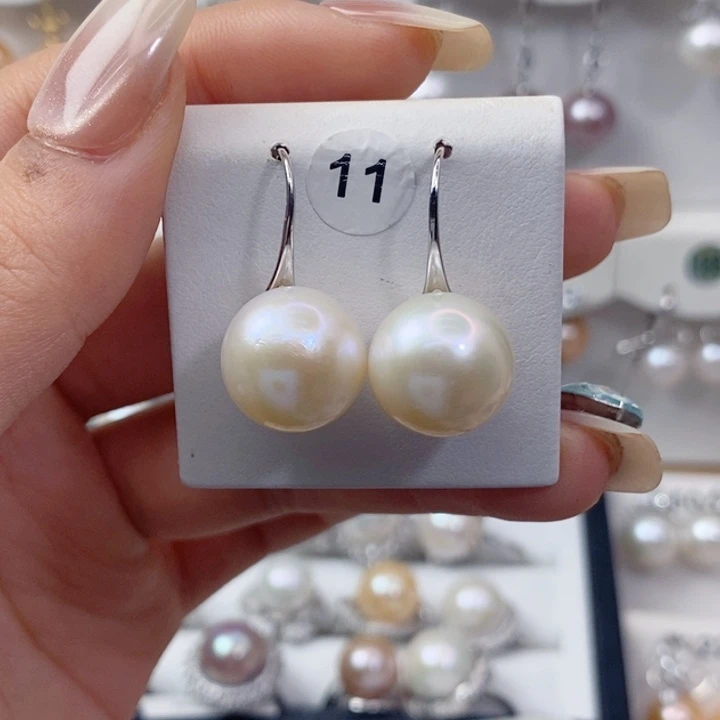 钱***多银S925镶嵌淡水珍珠耳饰