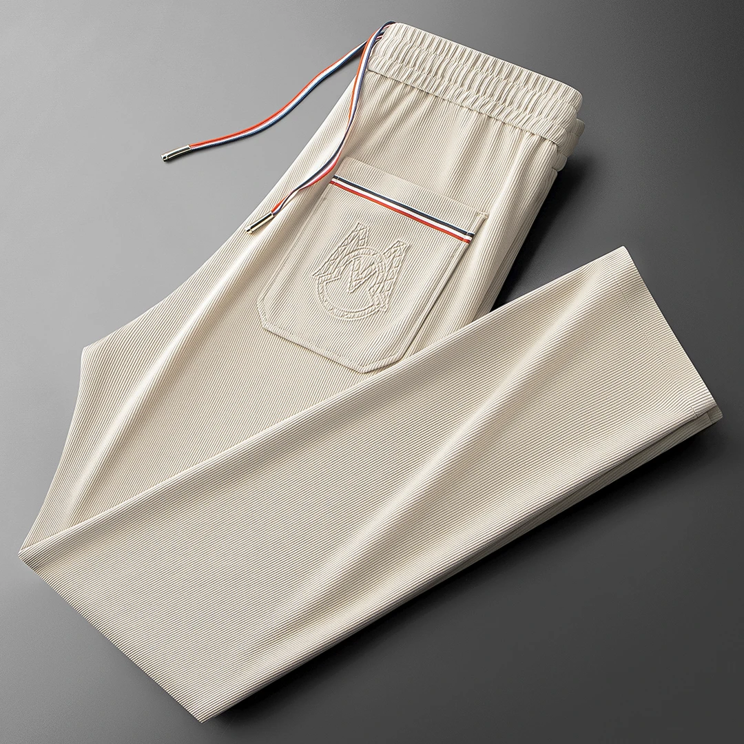 夏季高端时尚潮流冰丝提花运动卫裤男士薄款潮牌修身直筒休闲裤男