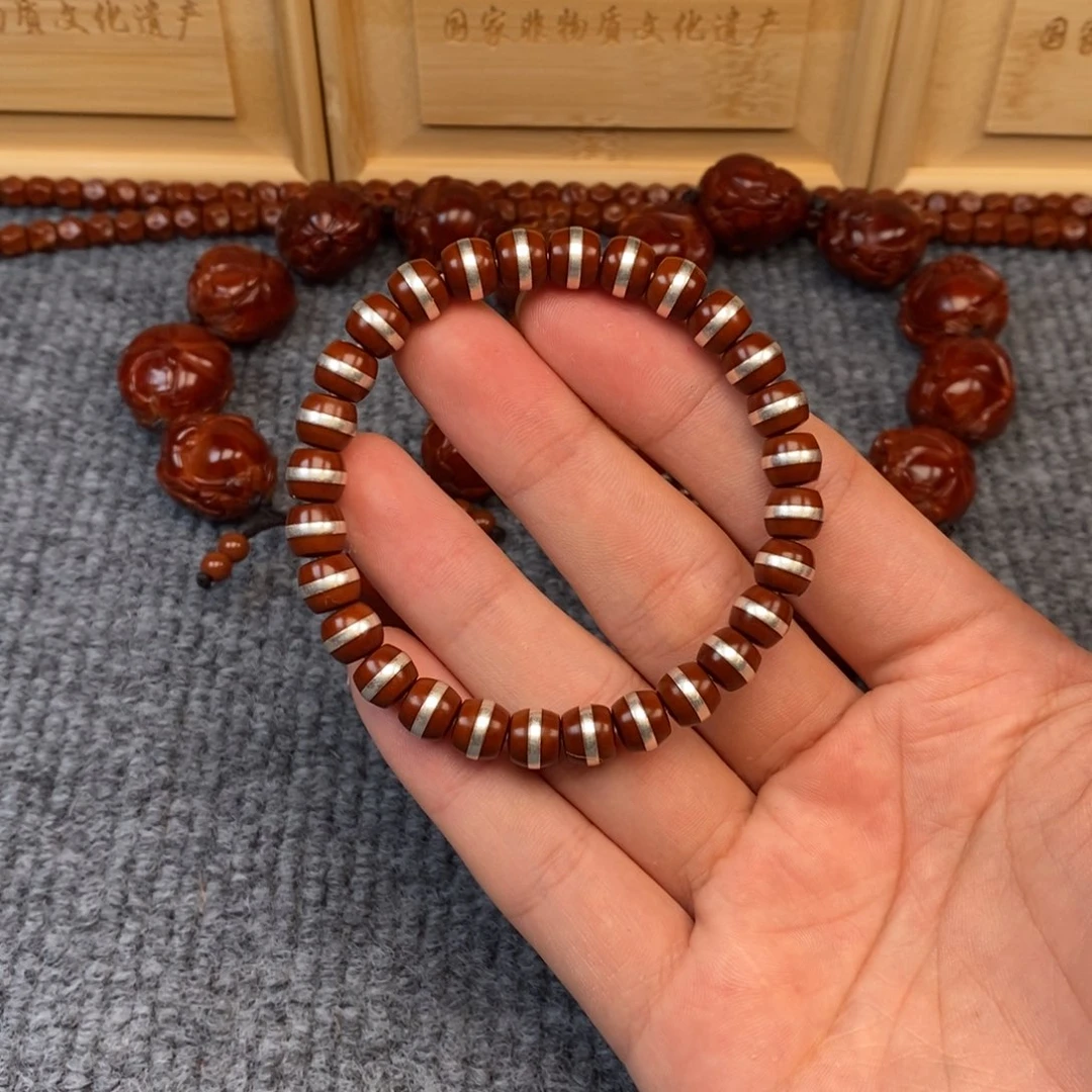 ****。橄榄核吊坠核尖银管