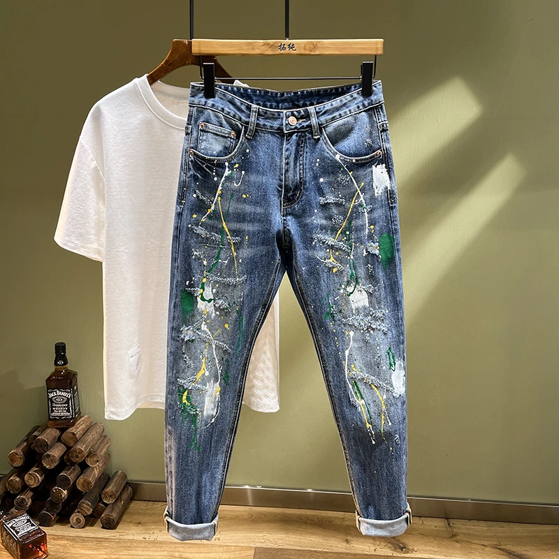 个性涂鸦泼墨破洞牛仔裤男高街修身小脚裤漆点潮牌韩版补丁长裤男