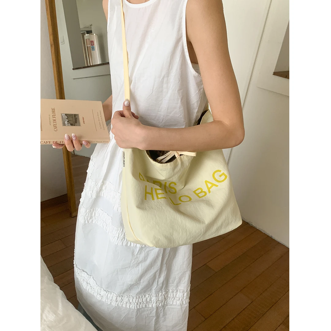 学院风字母帆布包包女2025新款潮时尚韩国托特包休闲大容量水桶包