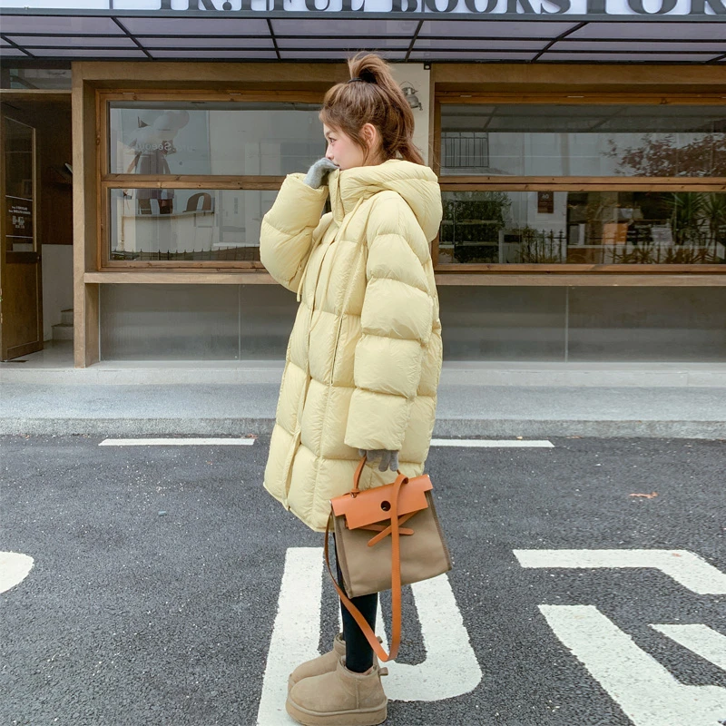 鹅黄色羽绒服女中长款2024冬季新款奶呼呼韩系氛围感温柔风面包服