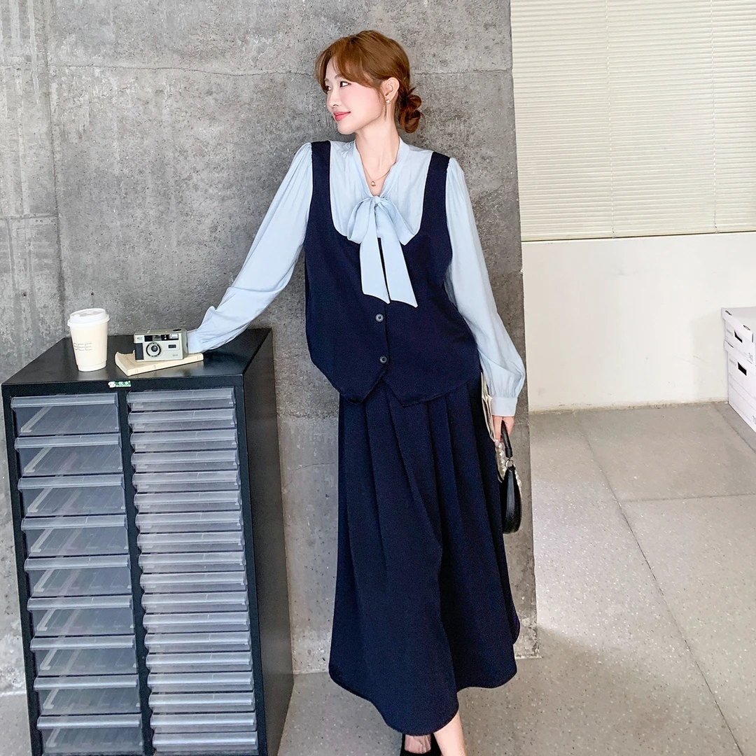 深蓝色轻熟风气质套装裙女秋2025新款假两件拼接上衣半身裙两件套