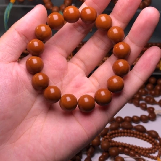 宗***胜橄榄核手串1.35光珠