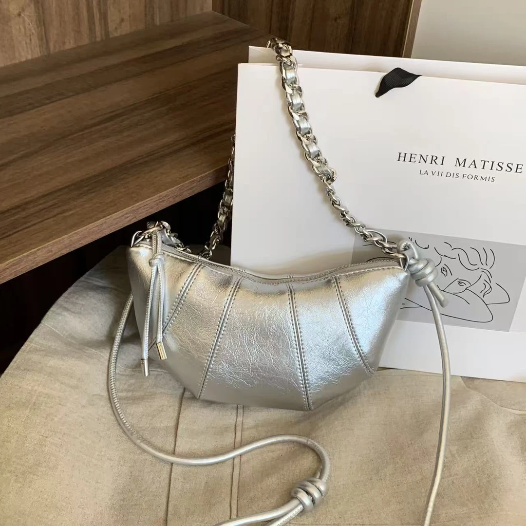 高质感牛角饺子包 单肩斜跨包拼接型时尚休闲斜挎包