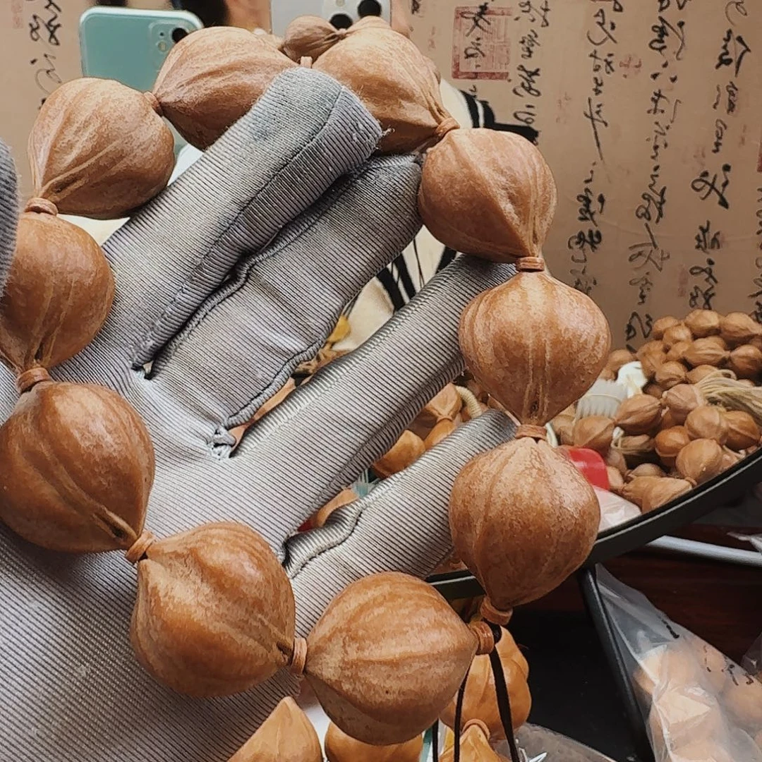 否***一手串橄榄核蒜头核