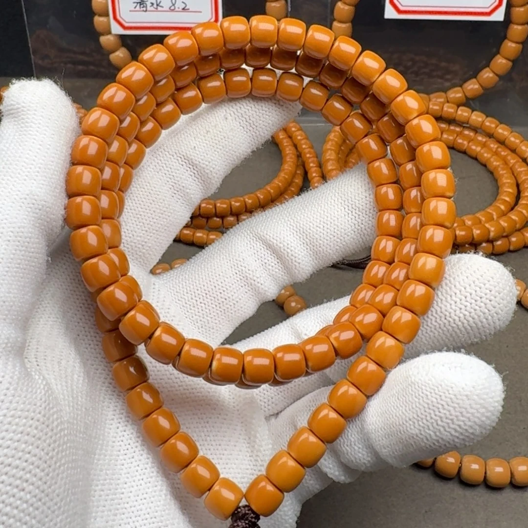 谋***财橄榄核吊坠老挝核尖长串6.5mm 三花白