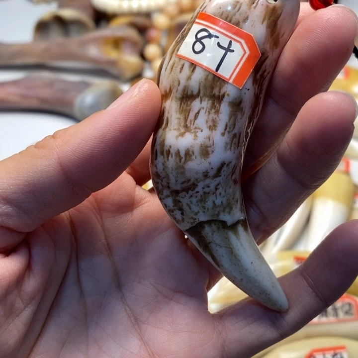 驼骨把件驼骨把件紫色牙牙