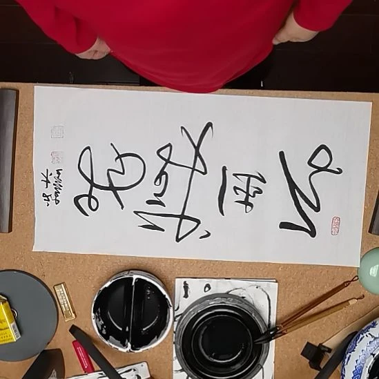 折扇四字吉语手工书写