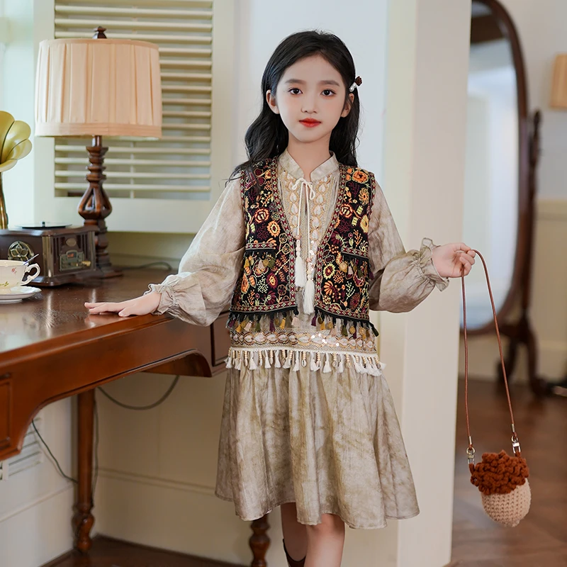 53899女童复古风铃动流苏马甲2025秋季新款女孩西域民族风连衣裙