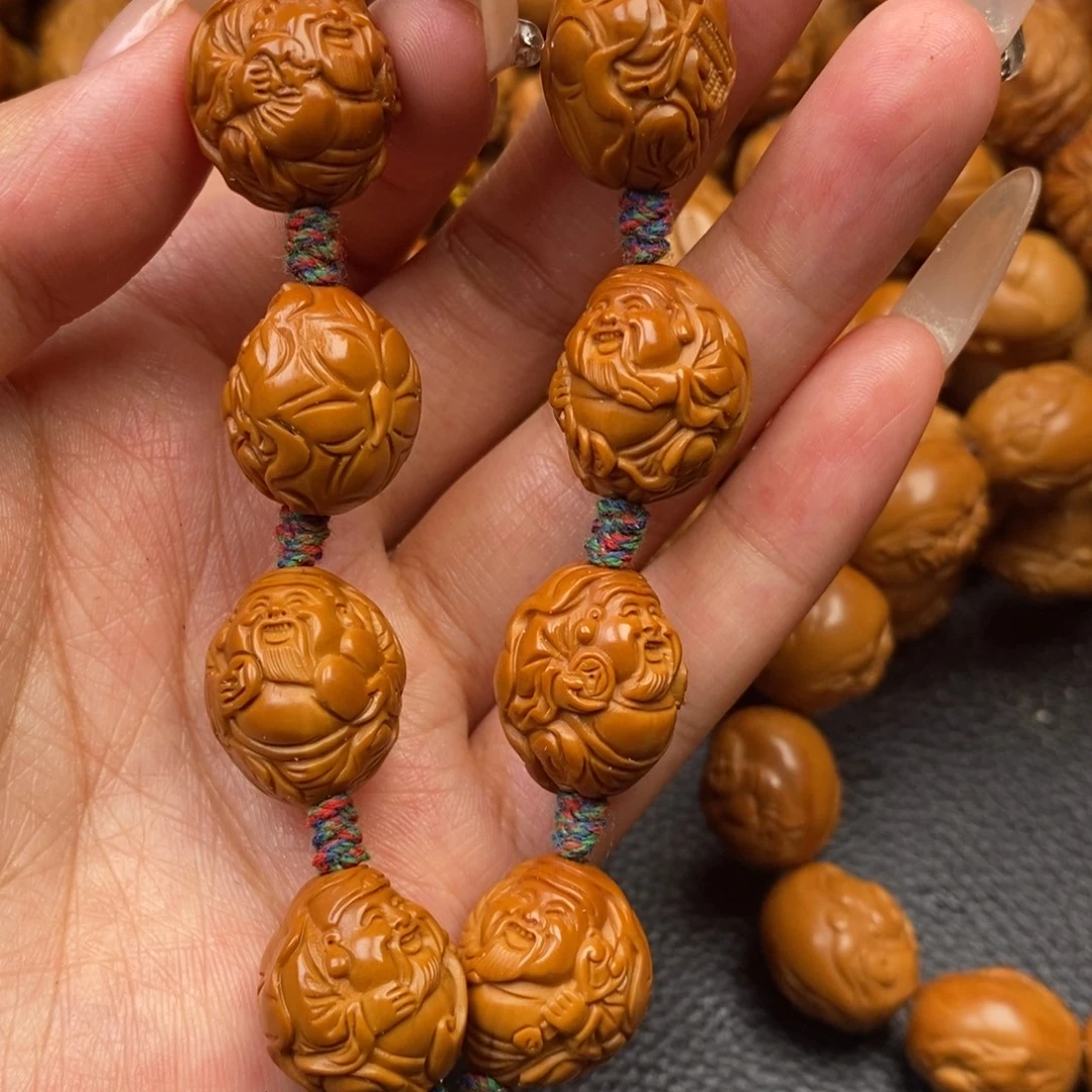 橄榄核把件荷叶财神