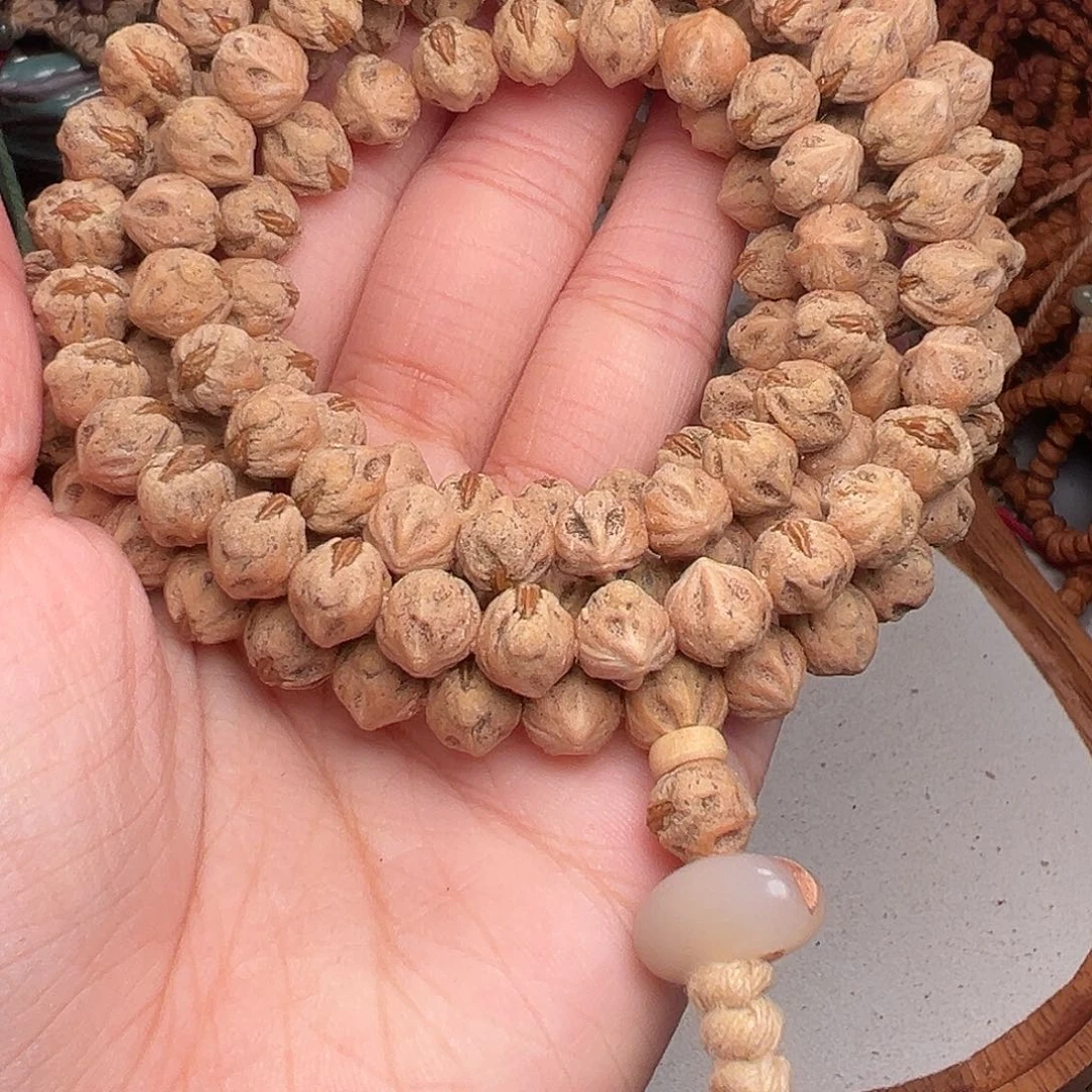 谷***龙柏香籽/百香籽吊坠