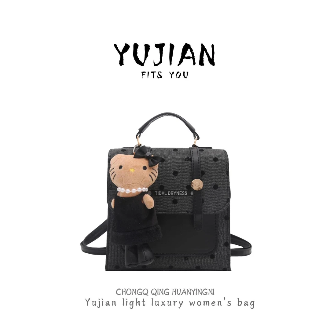 复古简约洋气波点学院风大容量休闲女双肩包