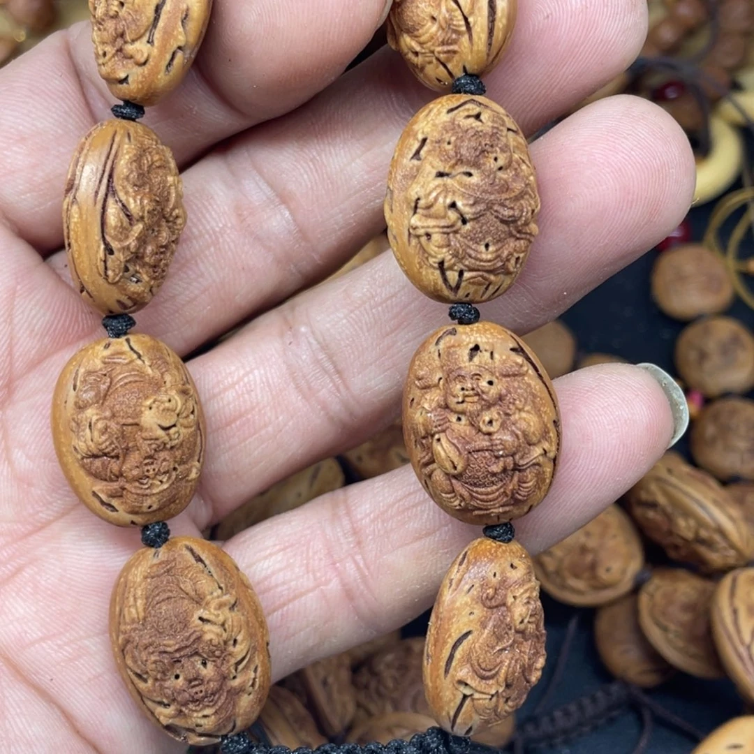 桃核雕刻财神手串