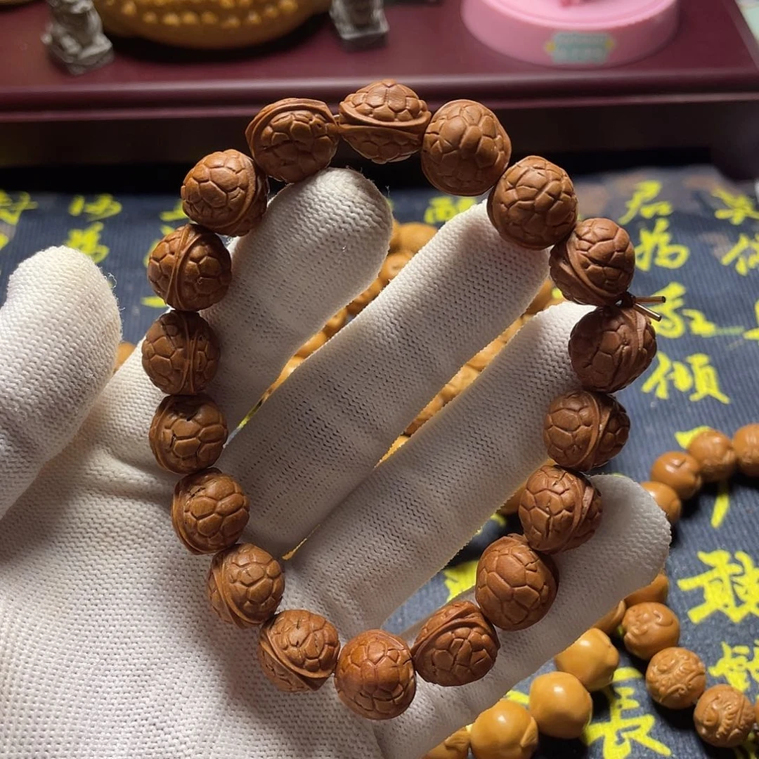 崮**M龙纹桃核雕刻瑕疵富甲天下