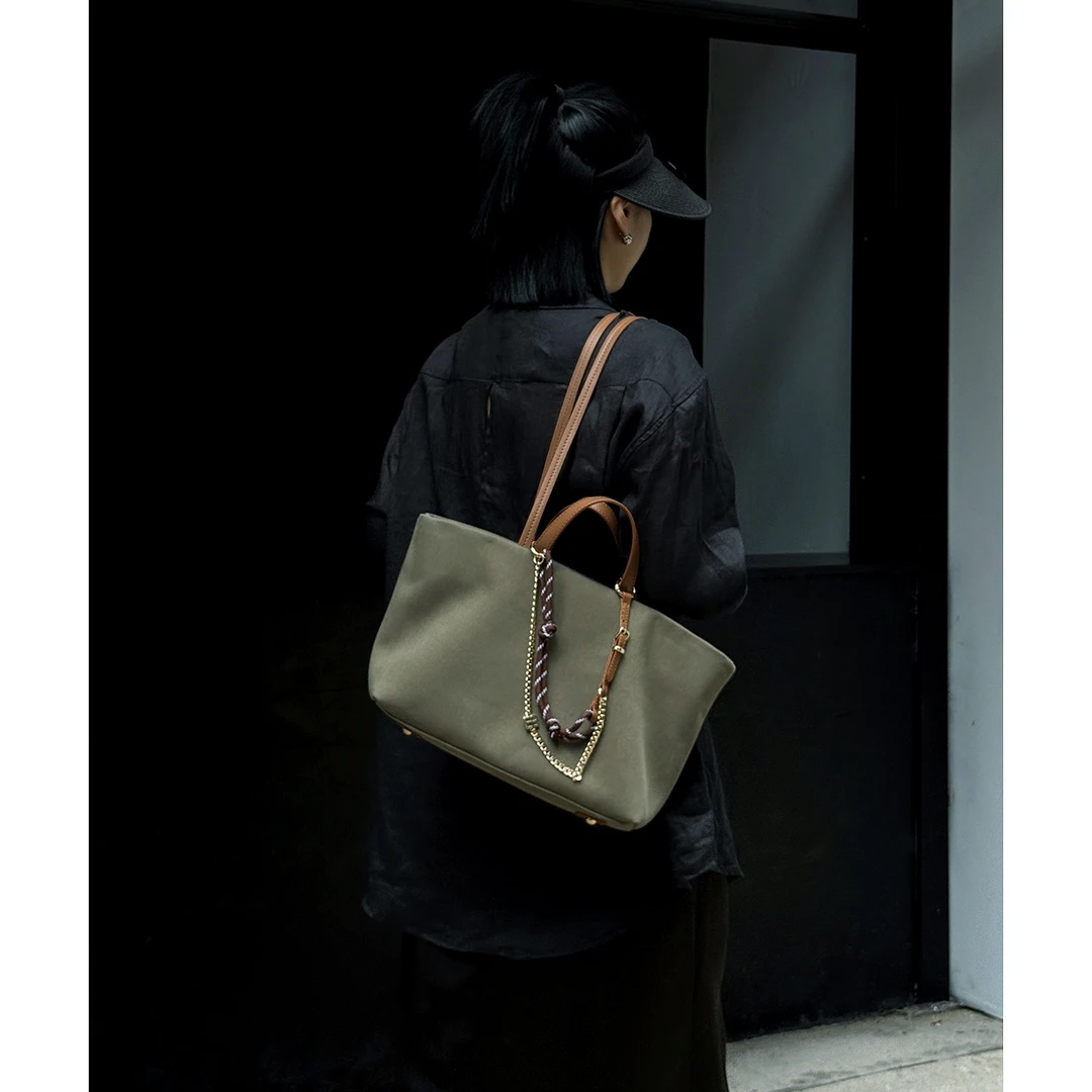 JISHE即奢高版本极简复古风牛皮手提挂饰搭衣神器托特包AL135