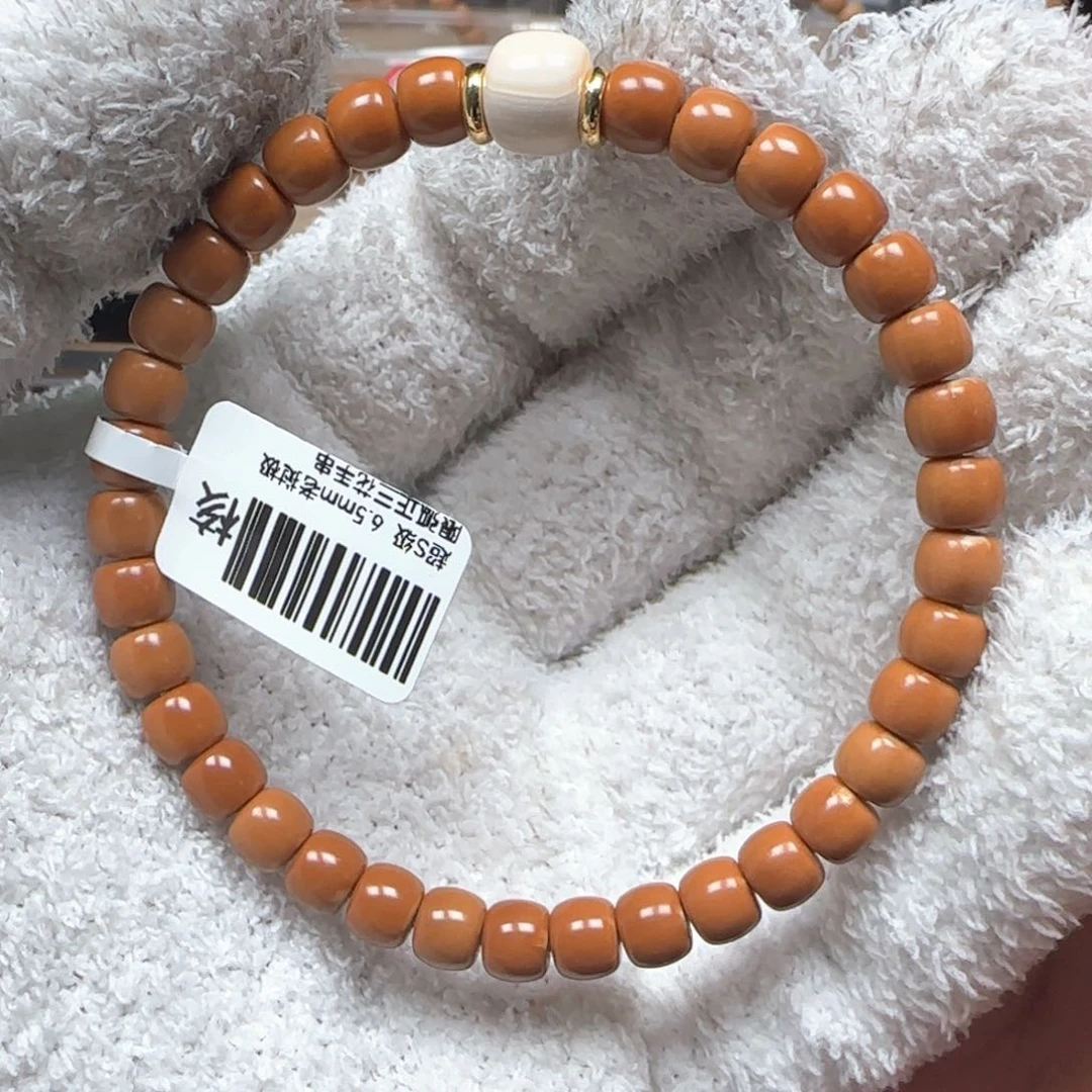 橄榄核吊坠老挝6.5mm三花极限弧