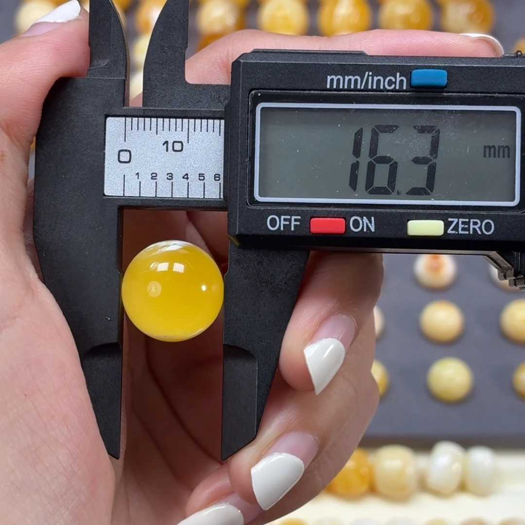 琥珀未镶嵌裸石焦皮金橘溶洞16.3mm