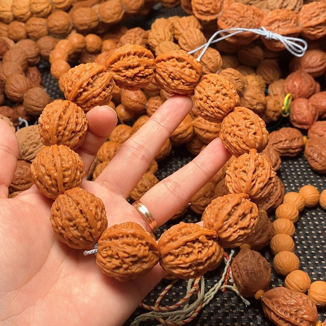 钟***诚文玩核桃吊坠粗筋