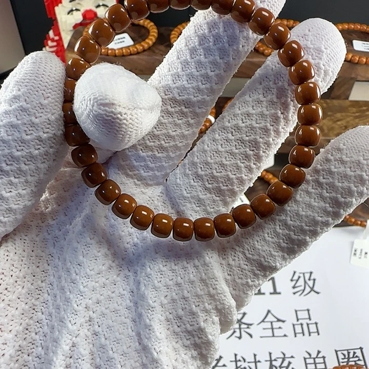 栗***子手串橄榄核6.6mm 老挝红核核尖全品
