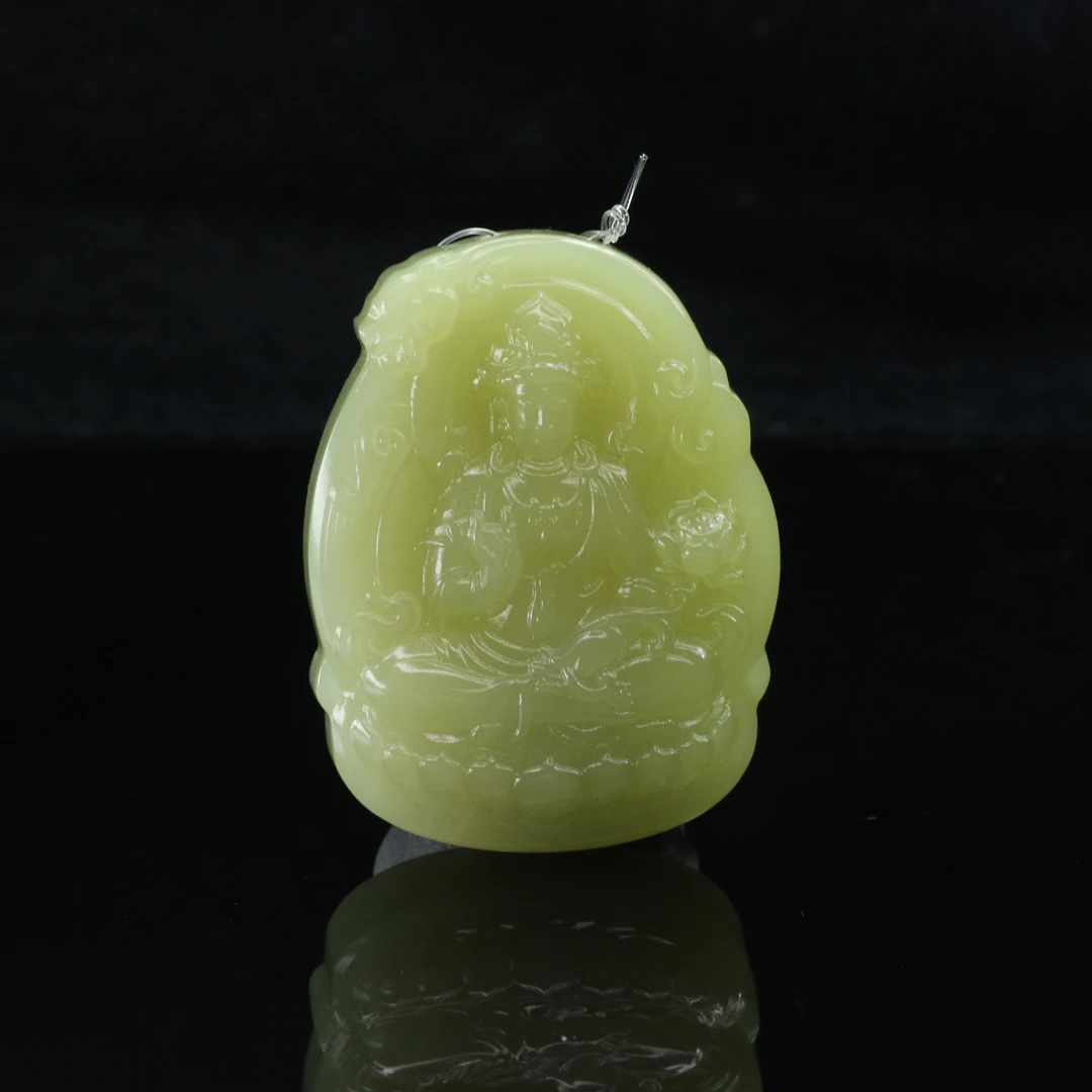 8和田玉若羌黄口持莲观音/000536上海嘉禾拍卖