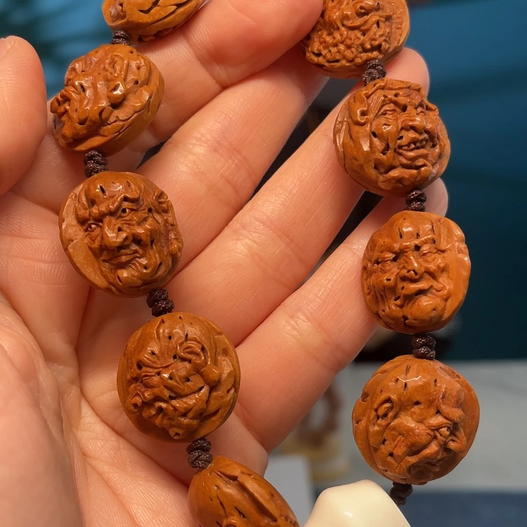 桃核浮雕罗汉头核雕作品