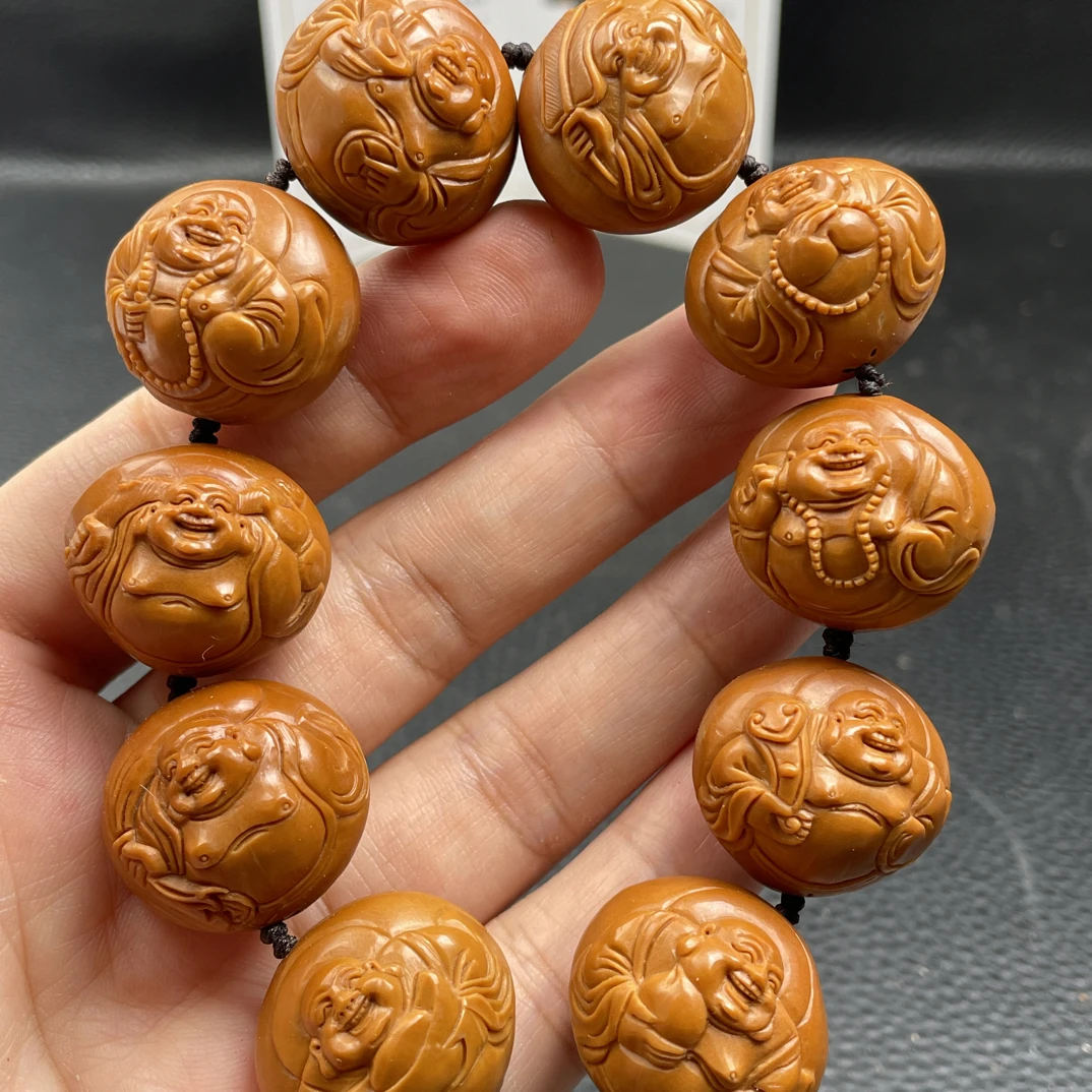 新款橄榄核铁核2.4四花核浮雕弥勒佛手串