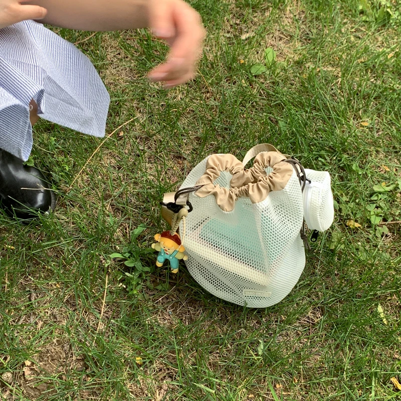 纯色简约韩版单根抽带日系网红斜挎包水桶包椭圆形便携户外单肩包