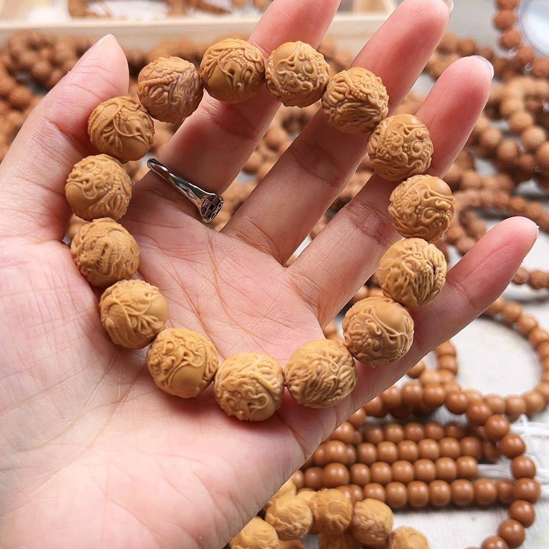 桃核手串瑕疵龙蛇缠（漏眼）