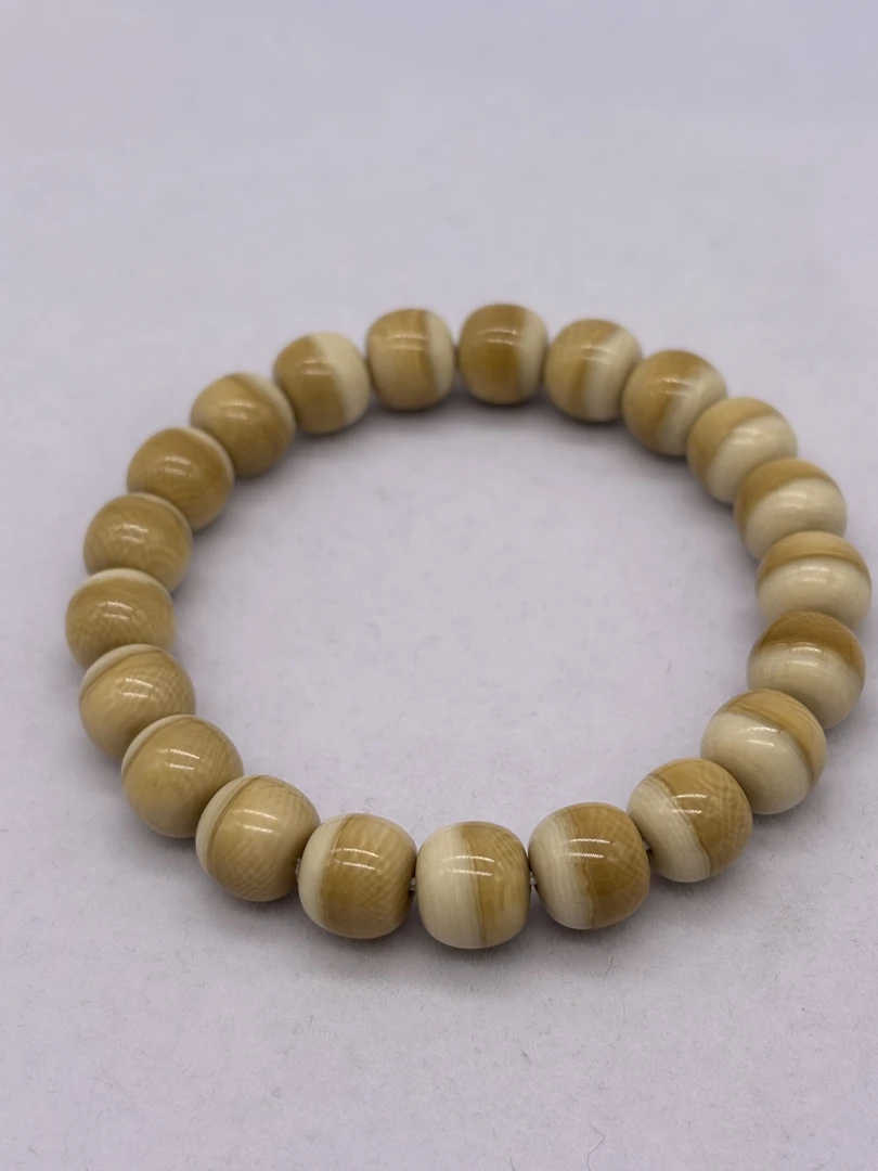 A076 猛犸牙咖色汉堡珠约10*9 金亮老师