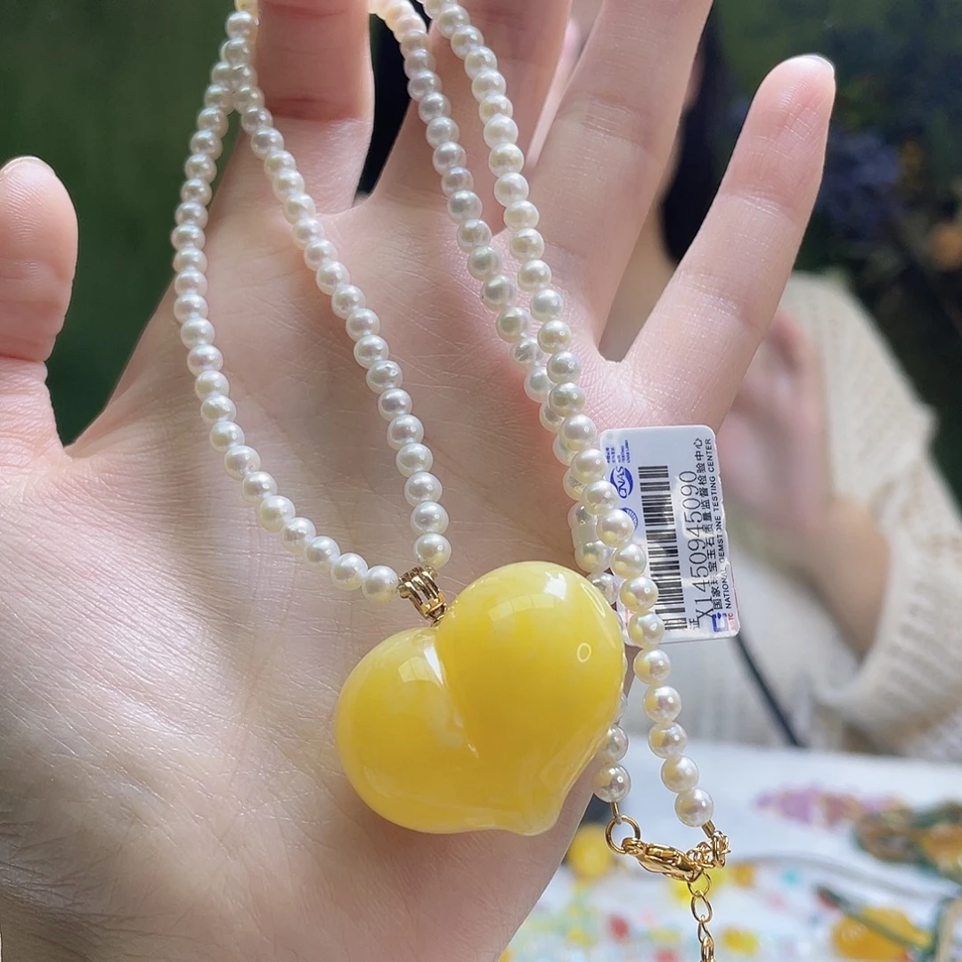 蜜蜡18K金镶嵌裸石吊坠