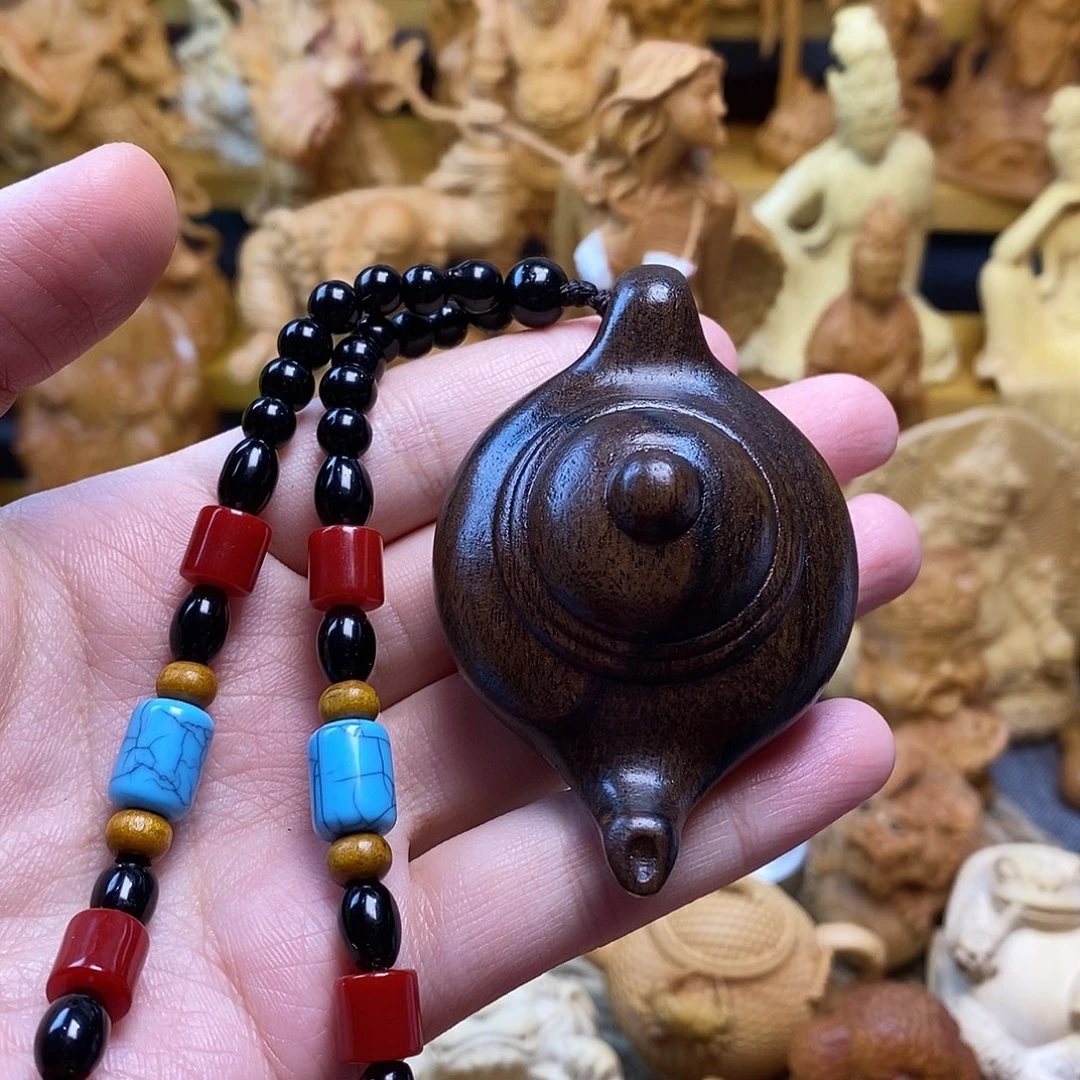 紫光檀手工雕刻把把壶