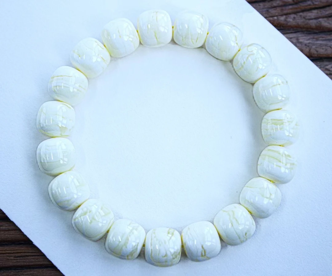 同料12mm瓷白花蜡顺纹虎皮老型手串，蜡质浓郁 器形一致 20.25克