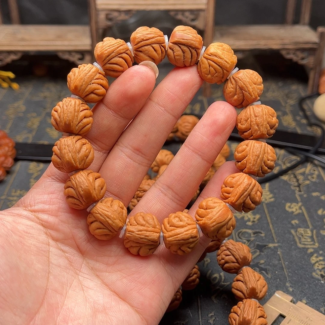 桃核吊坠包子头手串