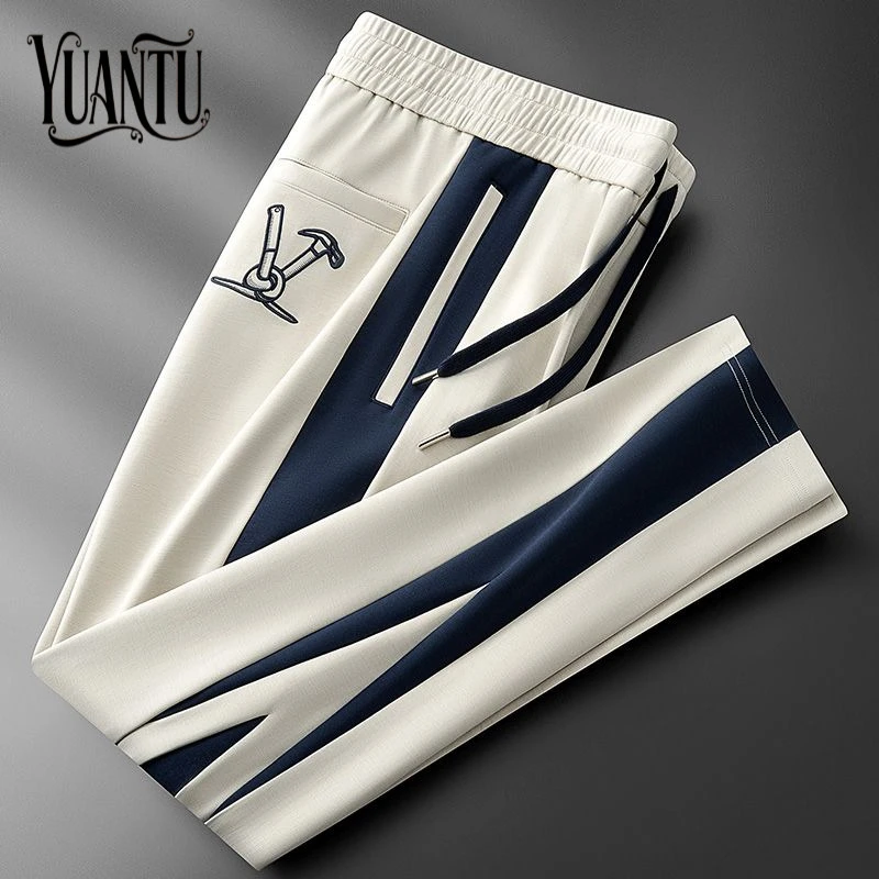 秋冬轻奢级撞色拼接空气层男士运动裤休闲裤欧货高档刺绣直筒卫裤