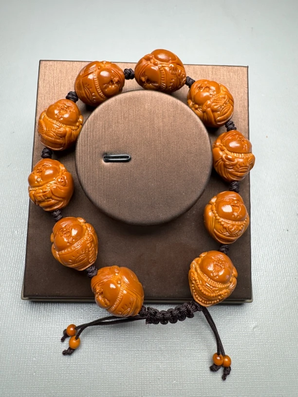 1橄榄核雕 1.8尺寸铁核手修嘟嘟财神文玩手串