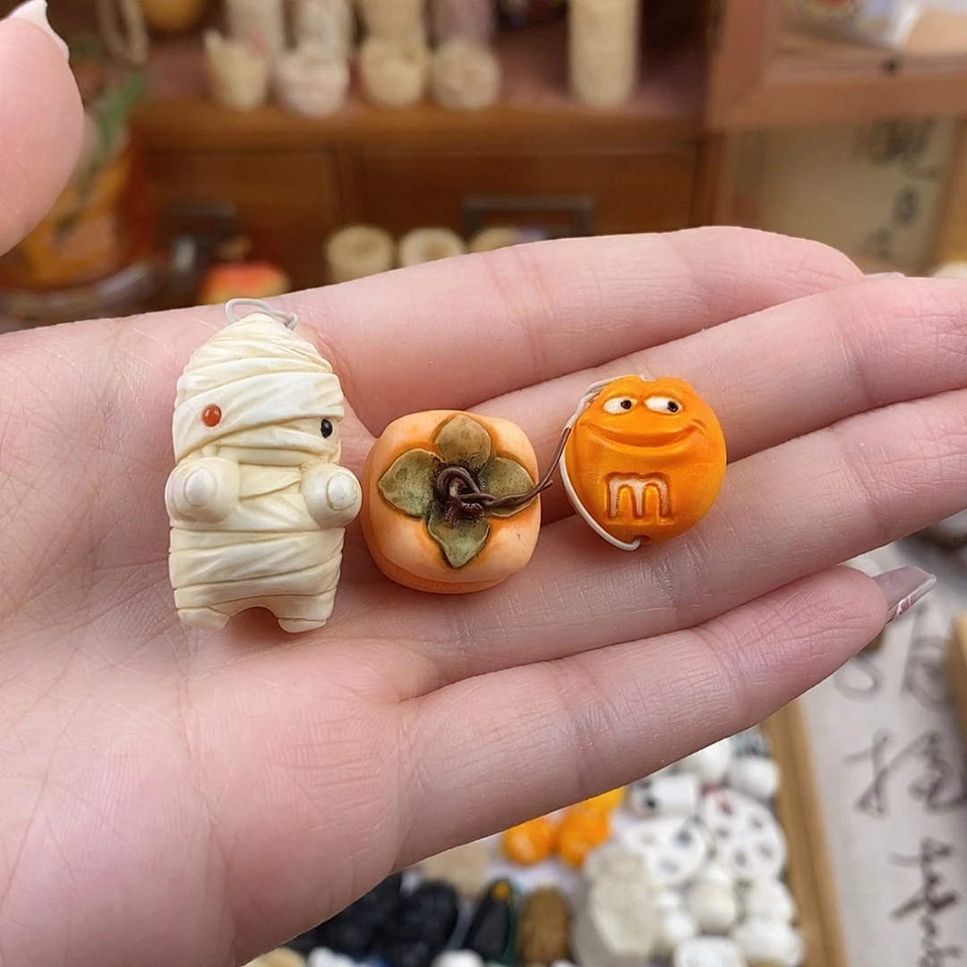 鹿骨把件何**暖M22鹿角雕刻的木乃伊➕m豆➕柿子