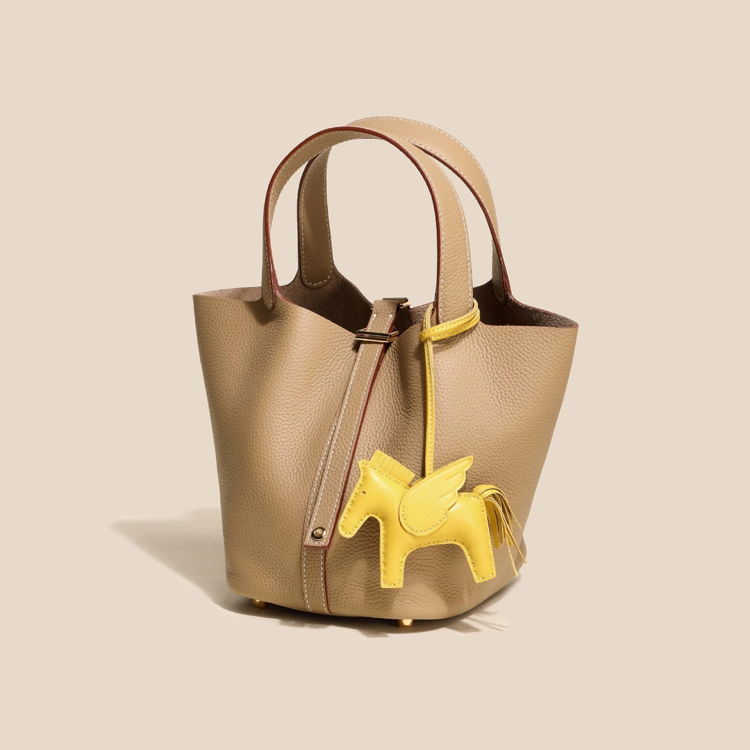 TC真皮女包头层牛皮包白搭时尚通勤手提包水桶包