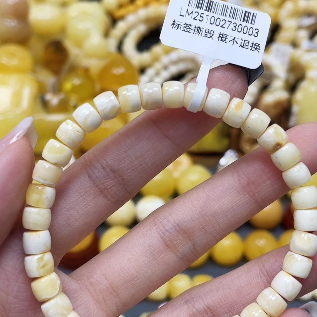 琥珀未镶嵌裸石6.3*5.1mm直切蜜蜡手串 瑕 福利款