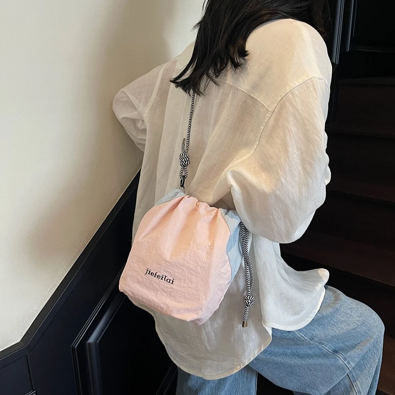 日系潮牌相机包女户外轻便束口包便携收纳包休闲摄影包单肩斜挎包