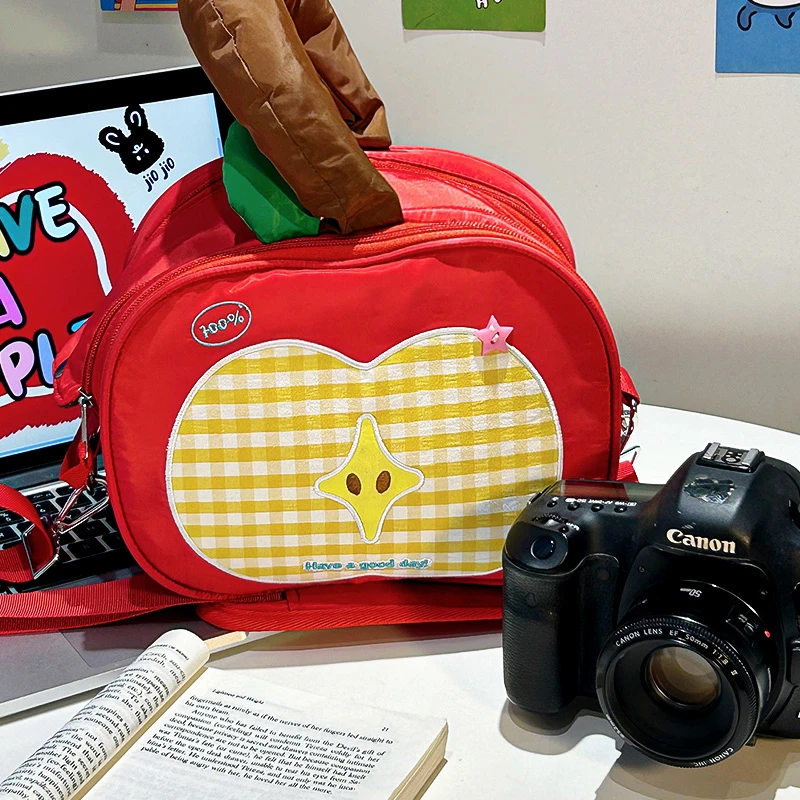 可爱苹果相机收纳包斜挎大容量化妆包防水外出随身携带单肩摄影包