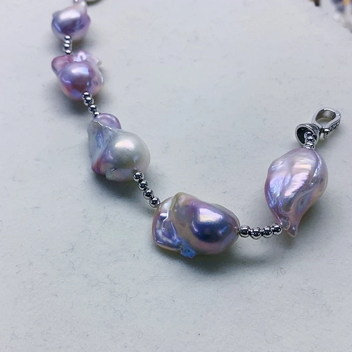 银S925镶嵌耳饰淡水珍珠阿****狗