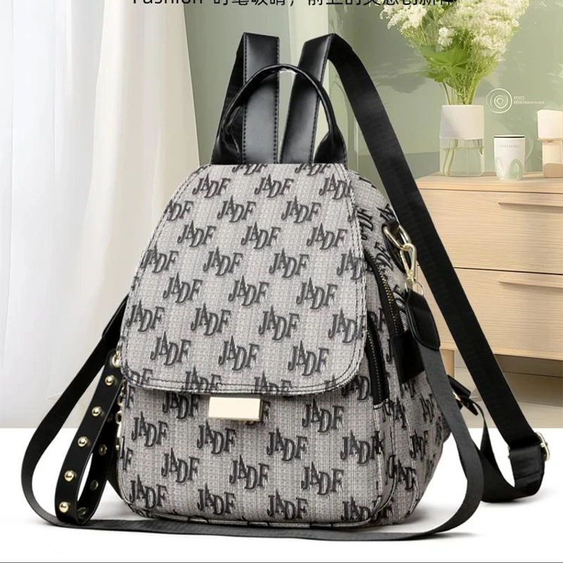 2069{长25高29厚16}字母多功能时尚百搭包盖式新款轻便旅行双肩包