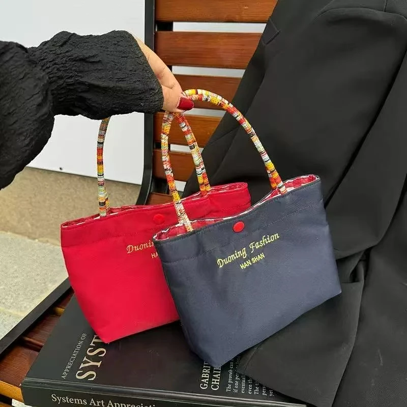 の気質の両面格子帆布のかばん通勤托特包潮复古休闲撞色手拎包