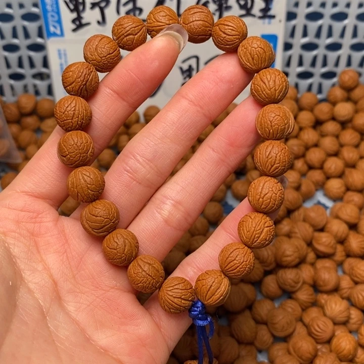 桃核手串小*11尺寸左右野生甲骨纹21+2颗