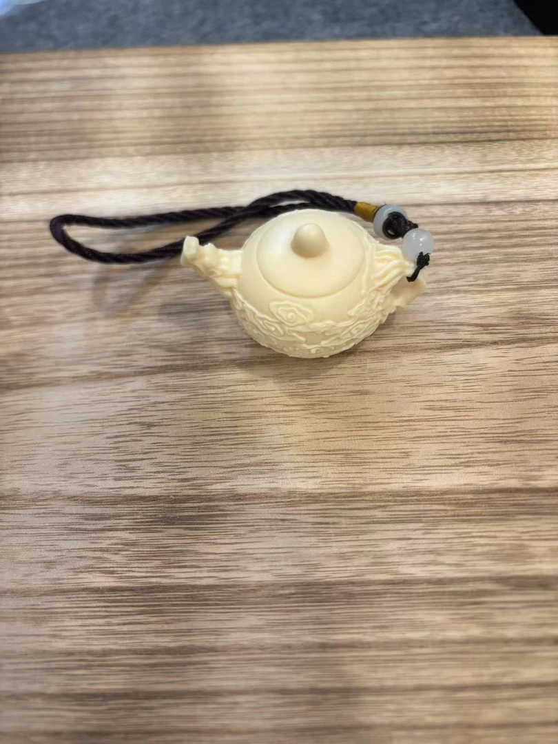 猛犸龙头壶把件一个